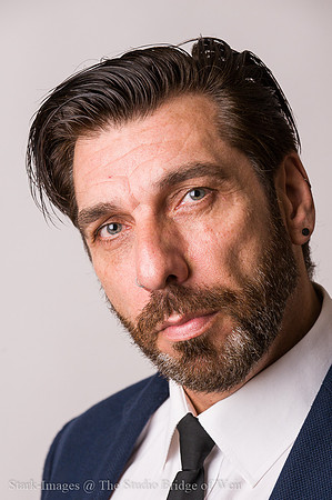 Studio portrait of businessman looking at camera